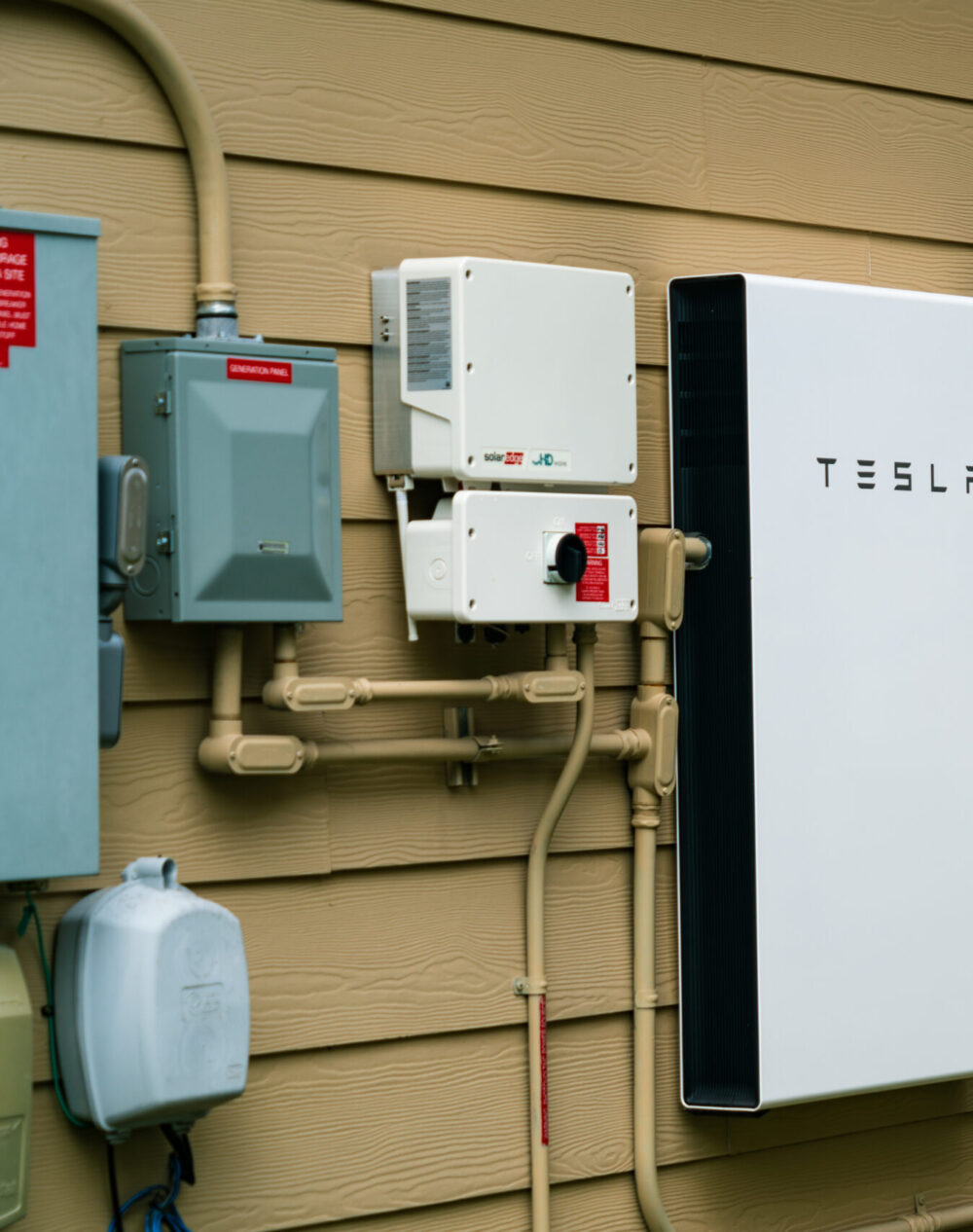SolarEdge Inverter and Tesla Solar Battery mounted on wall